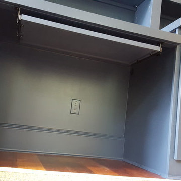 Dark Blue Office Built-in With Center Desk and Pullouts