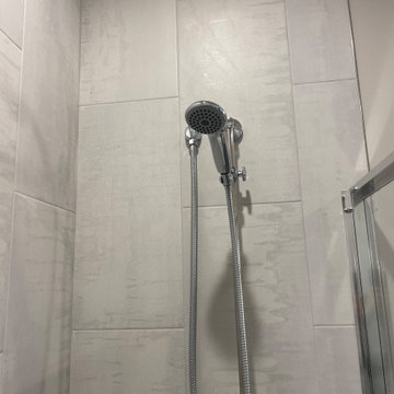 Beautiful Shower done with 12x24 porcelain tiles installed vertically.