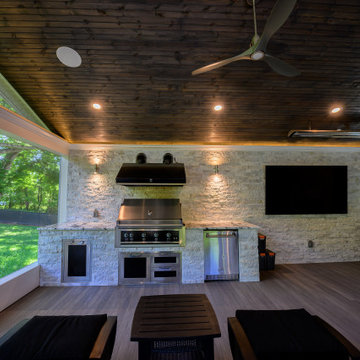 Screen Room with Stone Fireplace and Cooking Station