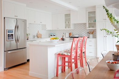 Inspiration for a large traditional l-shaped eat-in kitchen in Vancouver with shaker cabinets, white cabinets and with island.