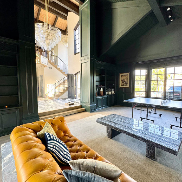 Family room - huge modern family room idea in Los Angeles with green walls