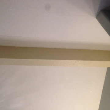 Drywall Ceiling Beams Wrapped in Distressed Hardwood Flooring