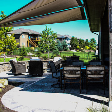 Summer Dining Experience With Stone Patio and Shading