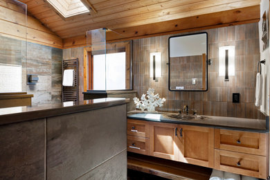 Example of a large mountain style master gray tile and metal tile pebble tile floor, single-sink, wood ceiling and wood wall bathroom design in Seattle with shaker cabinets, medium tone wood cabinets, a one-piece toilet, a drop-in sink, quartz countertops, gray countertops and a floating vanity