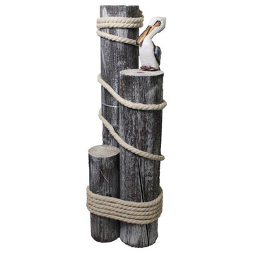 Set of Three Wood Pilings With Pelican and Fisherman's Rope