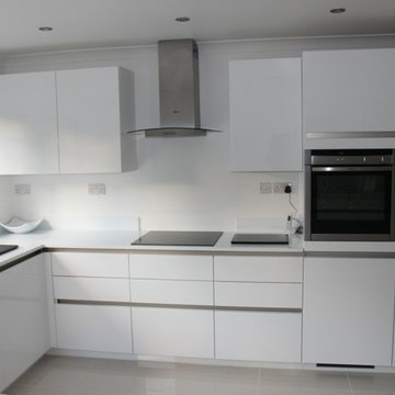 Handless Kitchen with White Finish in Northwood, London by Kudos Interior Design