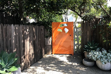 Inspiration for an eclectic front yard gravel garden path in Other.