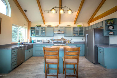 Eat-in kitchen - large cottage u-shaped ceramic tile, gray floor and wood ceiling eat-in kitchen idea in Other with a farmhouse sink, recessed-panel cabinets, turquoise cabinets, concrete countertops, gray backsplash, stone tile backsplash, stainless steel appliances, an island and gray countertops