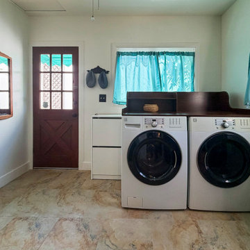 Pasadena kitchen remodel showing green cabinets and laundry room connection.