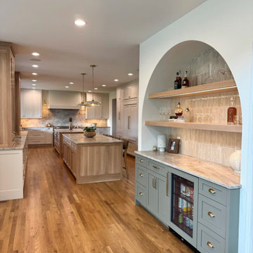 Frameless white perimeter with rift cut oak islands