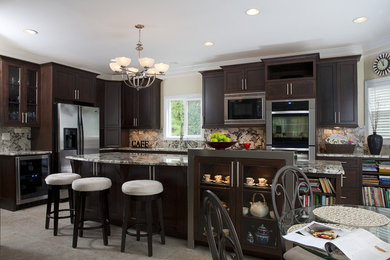 Inspiration for a mid-sized timeless u-shaped porcelain tile open concept kitchen remodel in Atlanta with shaker cabinets, dark wood cabinets, granite countertops, stone slab backsplash, stainless steel appliances and an island