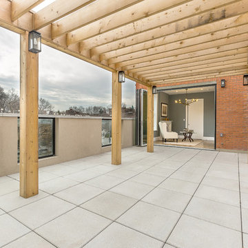A pergola atop a spacious roof deck