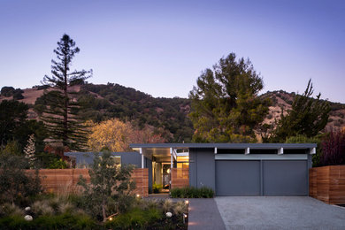 Example of a mid-sized 1960s gray one-story wood exterior home design in San Francisco with a mixed material roof and a gray roof