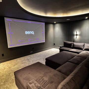 The Midnight Dome - Modern Black Home Theater with Coved Ceiling & Pit Sectional