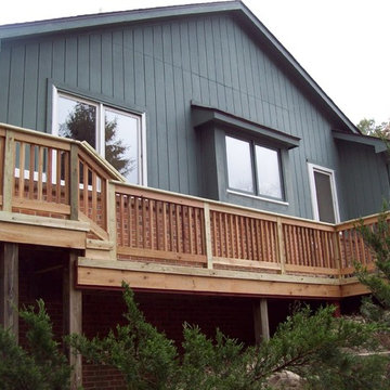LARGE BASIC PRESSURE TREATED DECK WITH CEDAR INFILL AND BALUSTERS