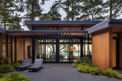 Patio - modern courtyard concrete paver patio idea in Seattle