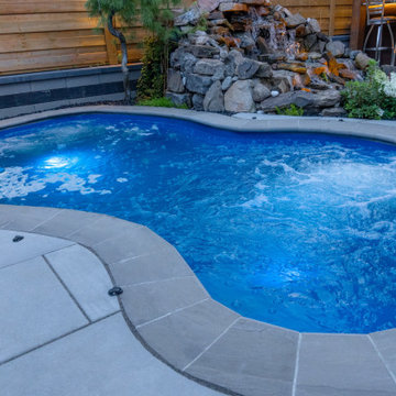 Pool with Rock Waterfall and Storage Shed