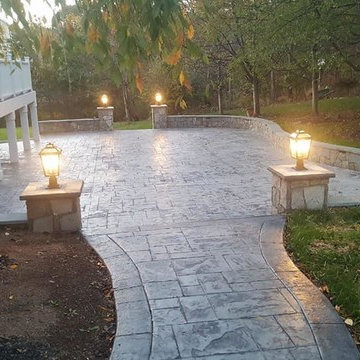 T-Stamped concrete patio, flagstone wall with columns