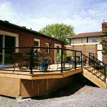 New Deck with Custom Privacy Wall and Glass Railing.