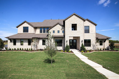 Inspiration for a large country two-storey stucco white house exterior in Dallas with a shingle roof.