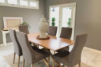 This is an example of a modern dining room in Brisbane.