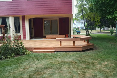 Large elegant backyard deck photo in Milwaukee with no cover