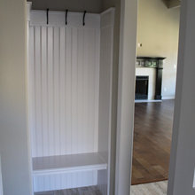 alcove next to downstairs bath for guest coats?