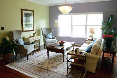 Living room - mid-sized transitional open concept medium tone wood floor and brown floor living room idea in Other with multicolored walls and no fireplace