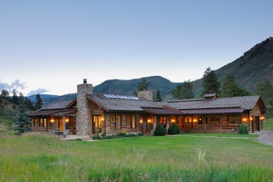 Large mountain style brown one-story wood exterior home photo in Denver