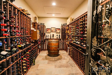 Large transitional porcelain tile wine cellar photo in Other with storage racks