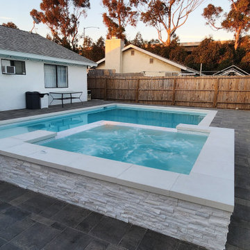 5\8" white tile, white plaster, white coping and raised spa.