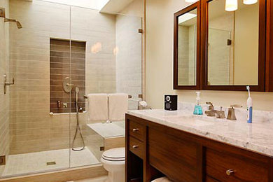 Inspiration for a small contemporary 3/4 ceramic tile ceramic tile bathroom remodel in Seattle with an undermount sink, furniture-like cabinets, medium tone wood cabinets, marble countertops, a two-piece toilet and white walls