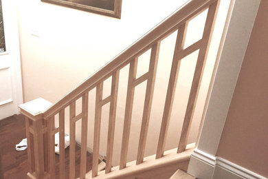 Inspiration for a small wooden straight wood railing staircase remodel in Tampa with wooden risers