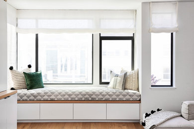 Mid-sized trendy enclosed family room photo in San Francisco with gray walls, no fireplace and a wall-mounted tv