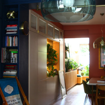 Blue colour drenched maximalist lounge