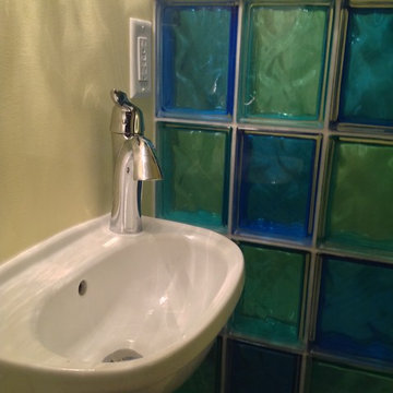 Wall mounted sink and glass block wall in Cleveland Heights Ohio half bathroom