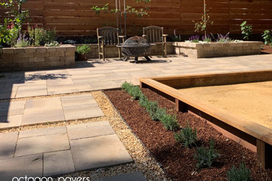 Photo of a contemporary backyard concrete paver landscaping in San Francisco.