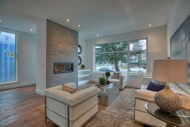 Example of a transitional living room design in Calgary