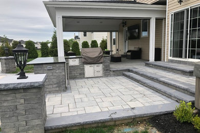 Robbinsville, NJ - Patio with outdoor kitchen and attached roof.