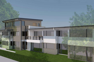 Inspiration för mellanstora moderna lägenheter, med tre eller fler plan, platt tak och tak i metall