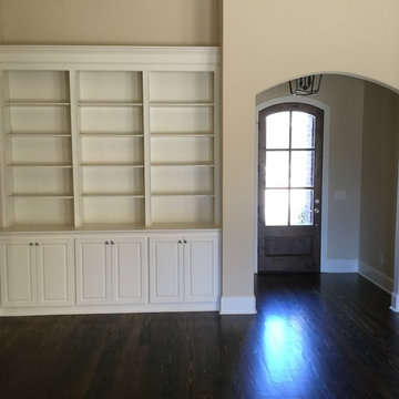 Built in book case, Arched case opening in foyer.