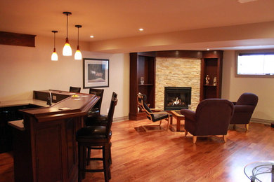 Basement - traditional basement idea in Ottawa with a corner fireplace