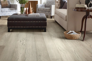 Example of a large transitional formal and open concept light wood floor and beige floor living room design in Austin with gray walls, a standard fireplace, a tile fireplace and no tv
