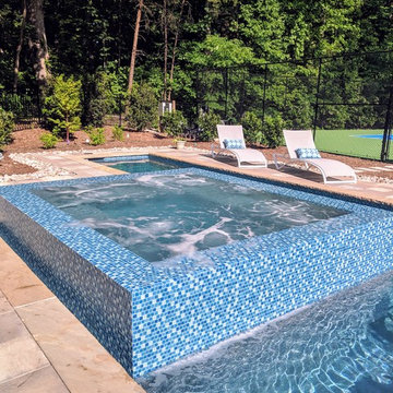Gorgeous Glass Tile 360 Spillover Spa and lap pool