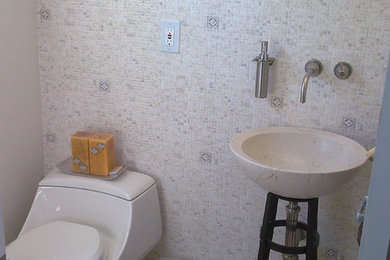 Inspiration for a contemporary beige tile and mosaic tile mosaic tile floor and beige floor powder room remodel in New York with a one-piece toilet, beige walls and an undermount sink