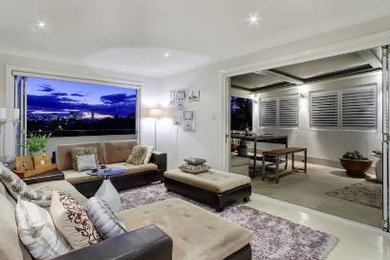 Mid-sized traditional open concept living room in Brisbane with white walls, porcelain floors, no fireplace and no tv.