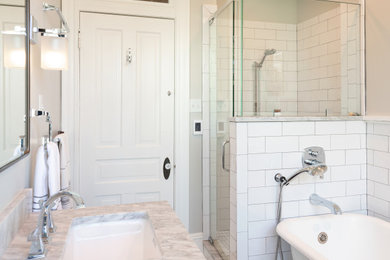 Bathroom - mid-sized traditional kids' white tile and ceramic tile marble floor, gray floor and double-sink bathroom idea in Richmond with recessed-panel cabinets, blue cabinets, a two-piece toilet, gray walls, an undermount sink, marble countertops, a hinged shower door, gray countertops and a freestanding vanity