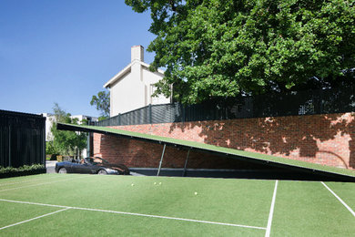 This is an example of a large traditional two-storey brick red exterior in Melbourne with a hip roof.