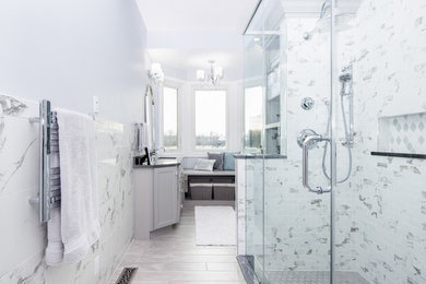 Inspiration for a large contemporary master blue tile and porcelain tile porcelain tile and gray floor alcove shower remodel in Indianapolis with shaker cabinets, gray cabinets, blue walls, an undermount sink, granite countertops, a hinged shower door and gray countertops