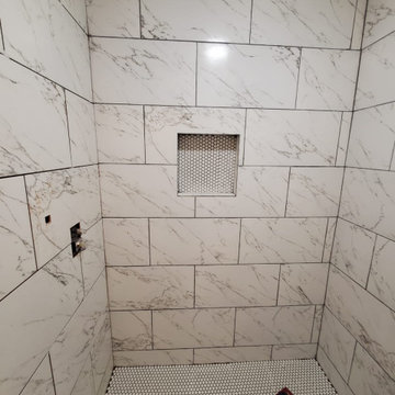 Bathtub Remodeled to a Fully Tiled Marble style Shower